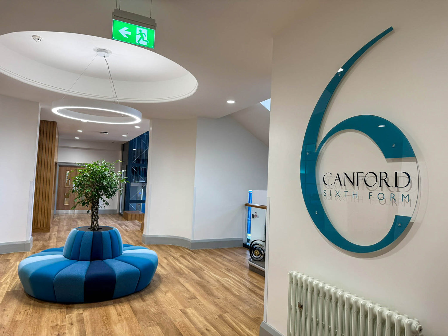 JDD circular terry banquette seating with planter in a reception area.