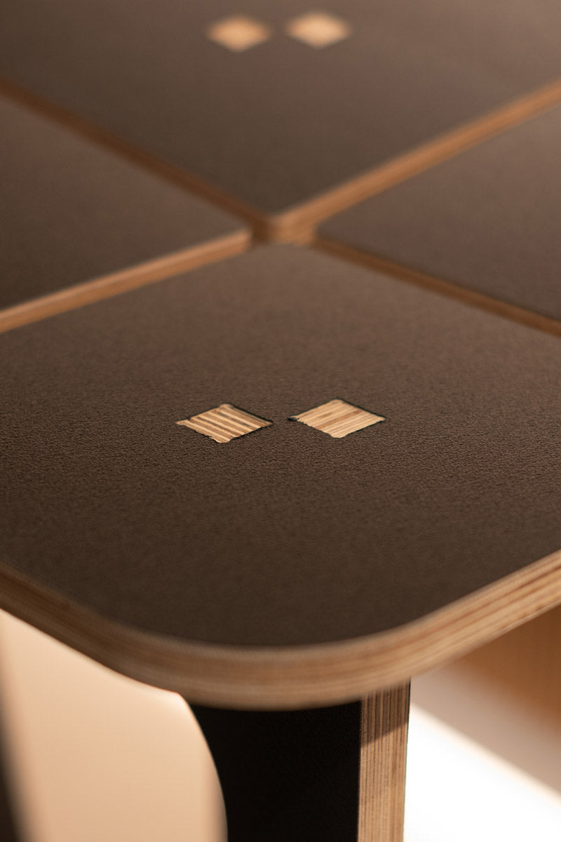 close up of a laminated wooden stool with notch detail