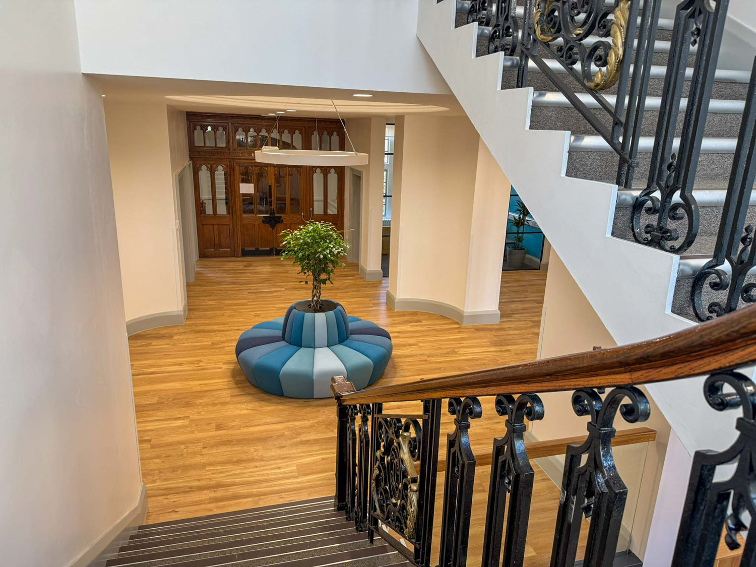 JDD circular terry banquette seating with planter in a reception area.