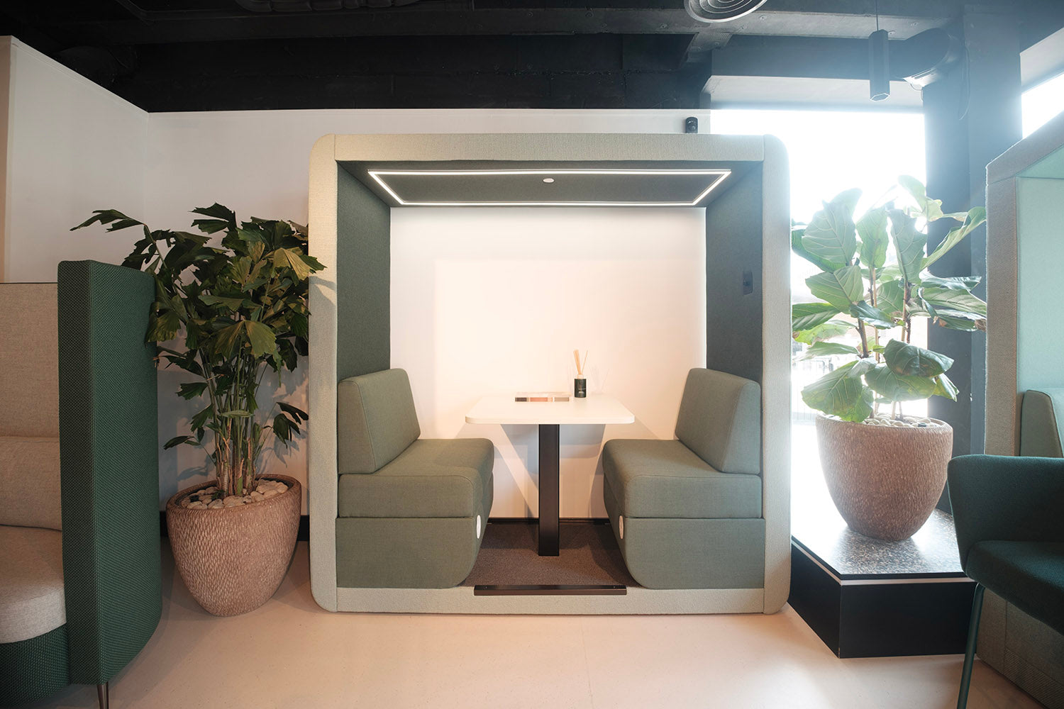 jdd bob 2 seat open sided meeting pod with power in the seats and a built in table