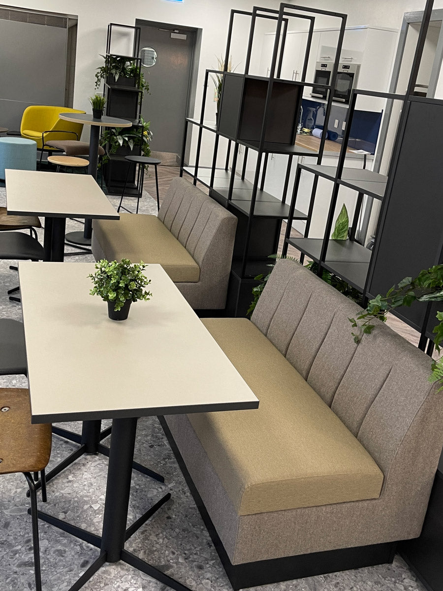 banquette seating with contrasting fabrics in a modern office